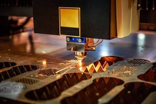 Laser cutting head profiling copper sheet metal Planet Industries