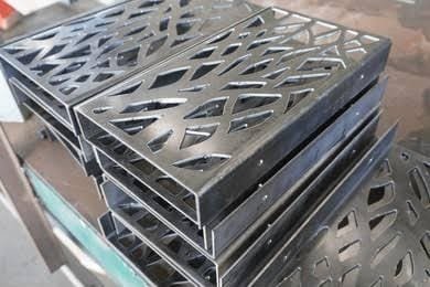 Laser cutting head profiling aluminium sheet metal Planet Industries